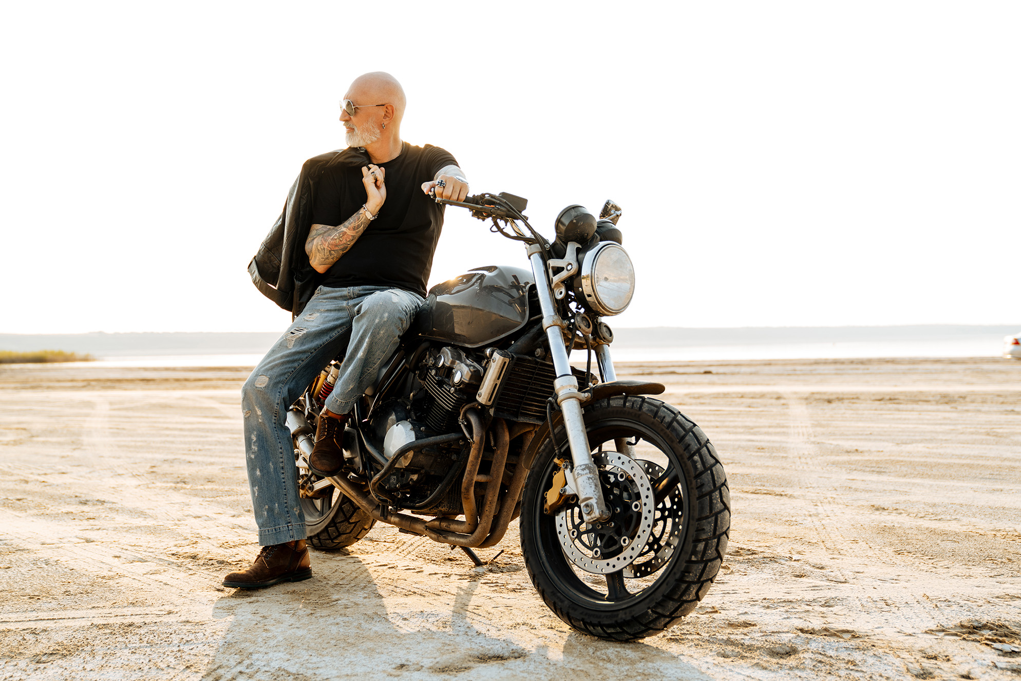 bold senior man with tattoo posing on motorcycle o 2023 11 27 05 03 43 utc